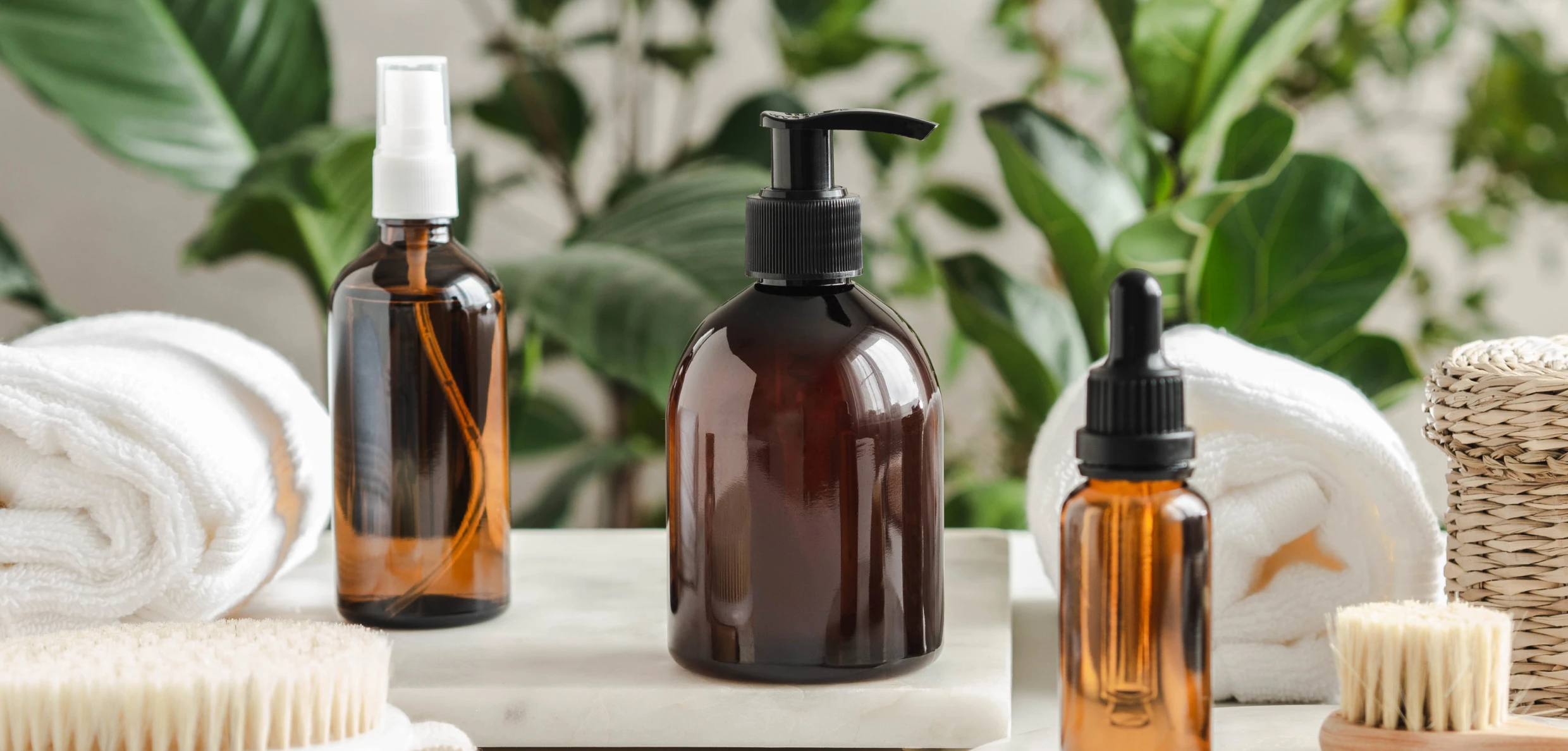 Organic beauty products and greenery background